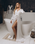 White bridal satin robe with long train, featuring lace cuffs, styled for romantic wedding day or boudoir moments