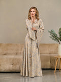 Model in a beige floral satin kimono robe with V-neck and flowing sleeves