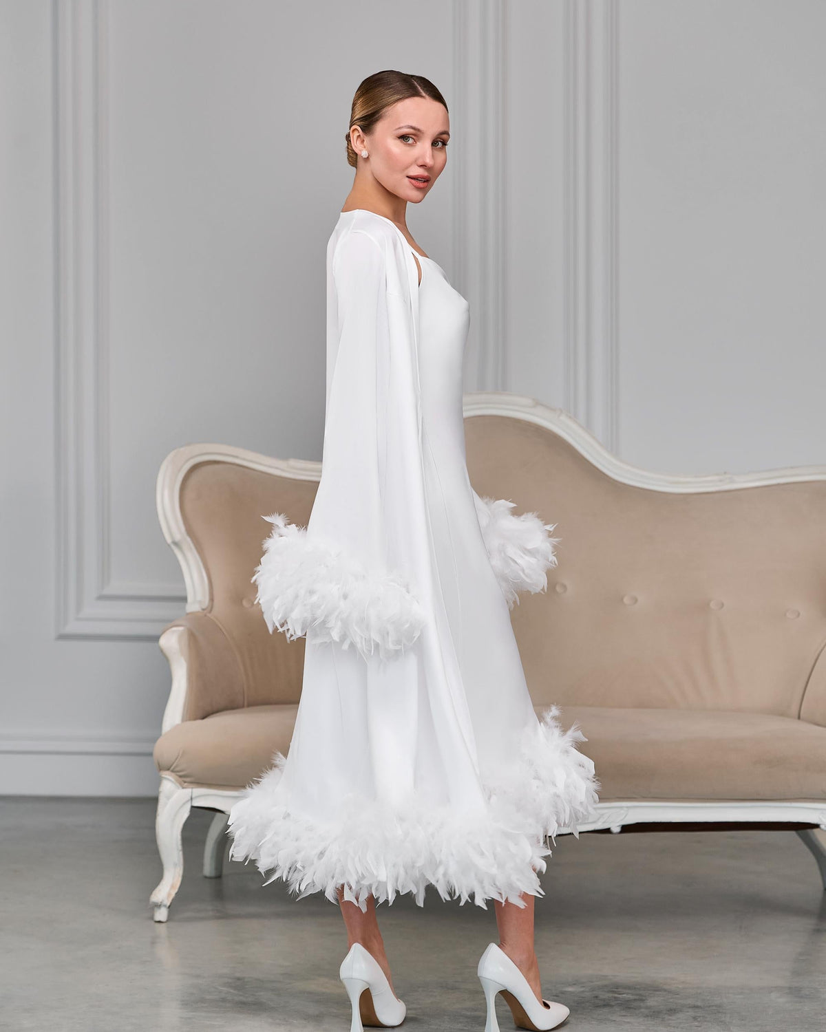 Back view of white feather-trimmed satin robe with long sleeves and detachable belt