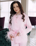 a woman in a pink outfit posing for a picture