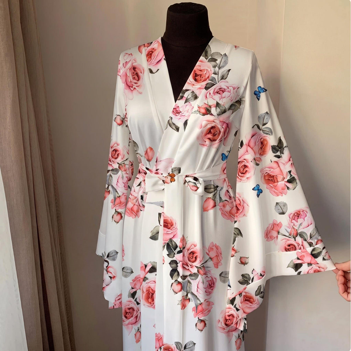 Ivory floral satin bridal robe with blush rose print and floor length wrap silhouette