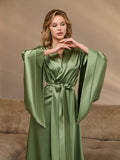 Wide draped 3/4 sleeves of a green silk satin kimono robe – close-up