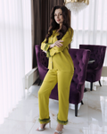 a woman in a yellow outfit posing for a picture