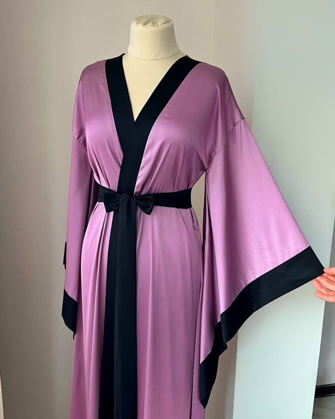 a woman's robe on a mannequin in a room