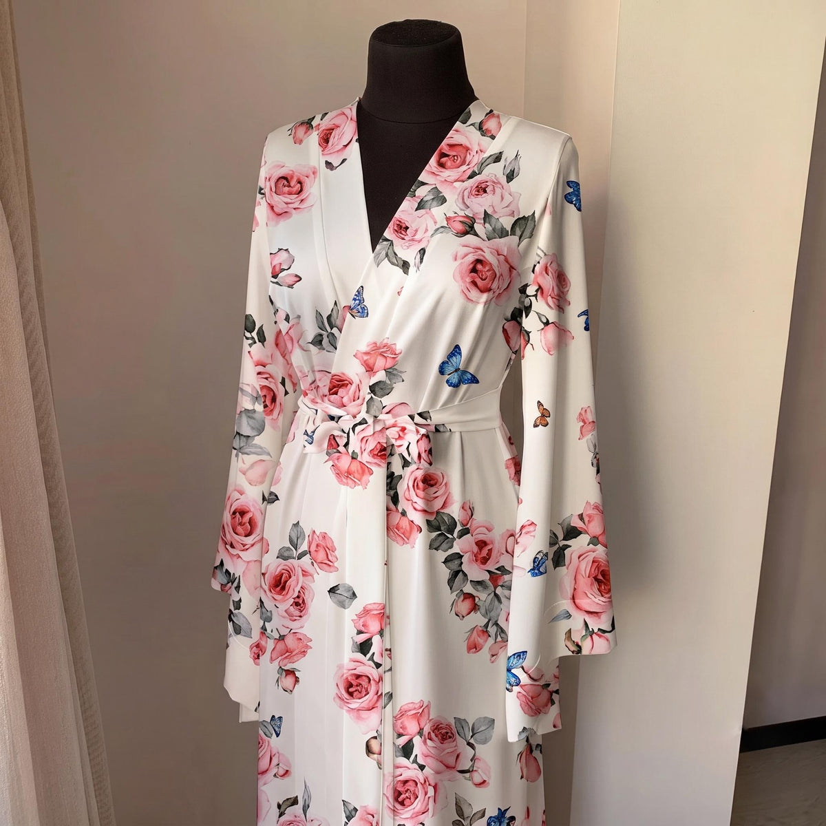 Ivory rose print kimono robe highlighting elegant long silhouette and smooth satin