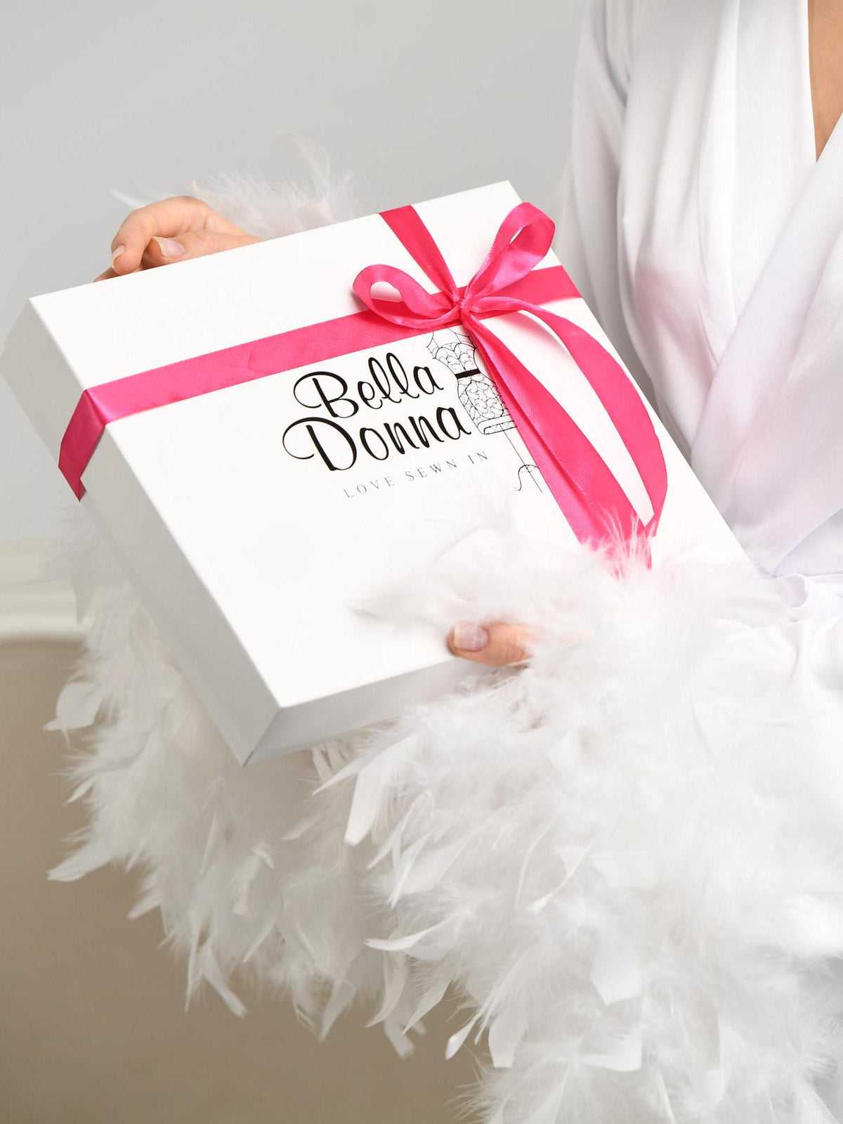 BellaDonnaUa gift box with pink ribbon – packaging for the white satin maxi slip dress