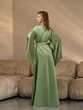 Back view of a long green silk kimono robe with belted waist