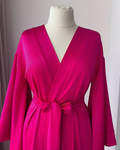 a woman's pink dress on a mannequin