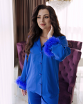 a woman in a blue outfit posing for a picture