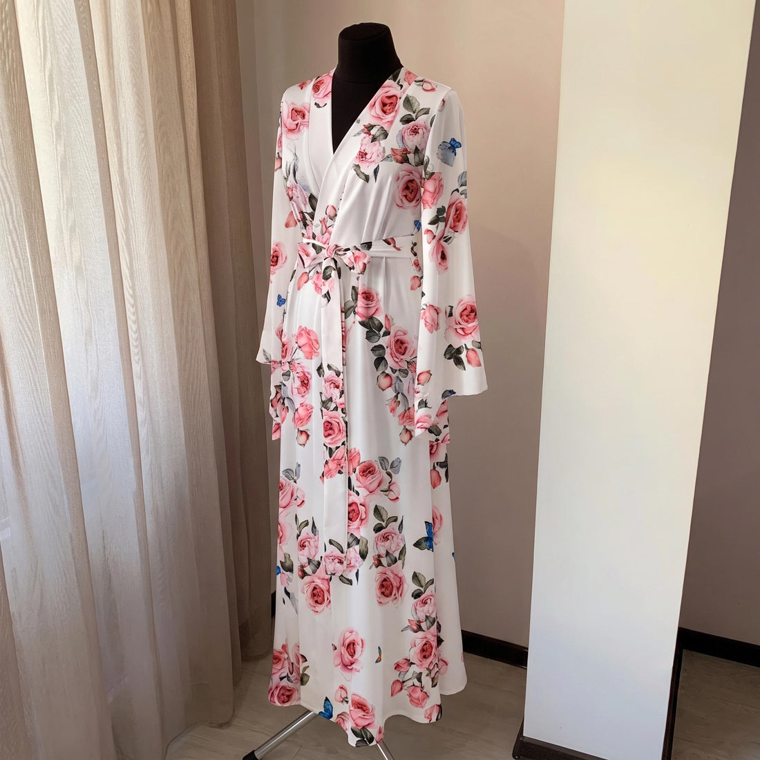 Ivory floral satin bridal robe with blush rose print and floor length wrap silhouette