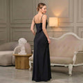 Back view of black satin maxi slip dress with spaghetti straps
