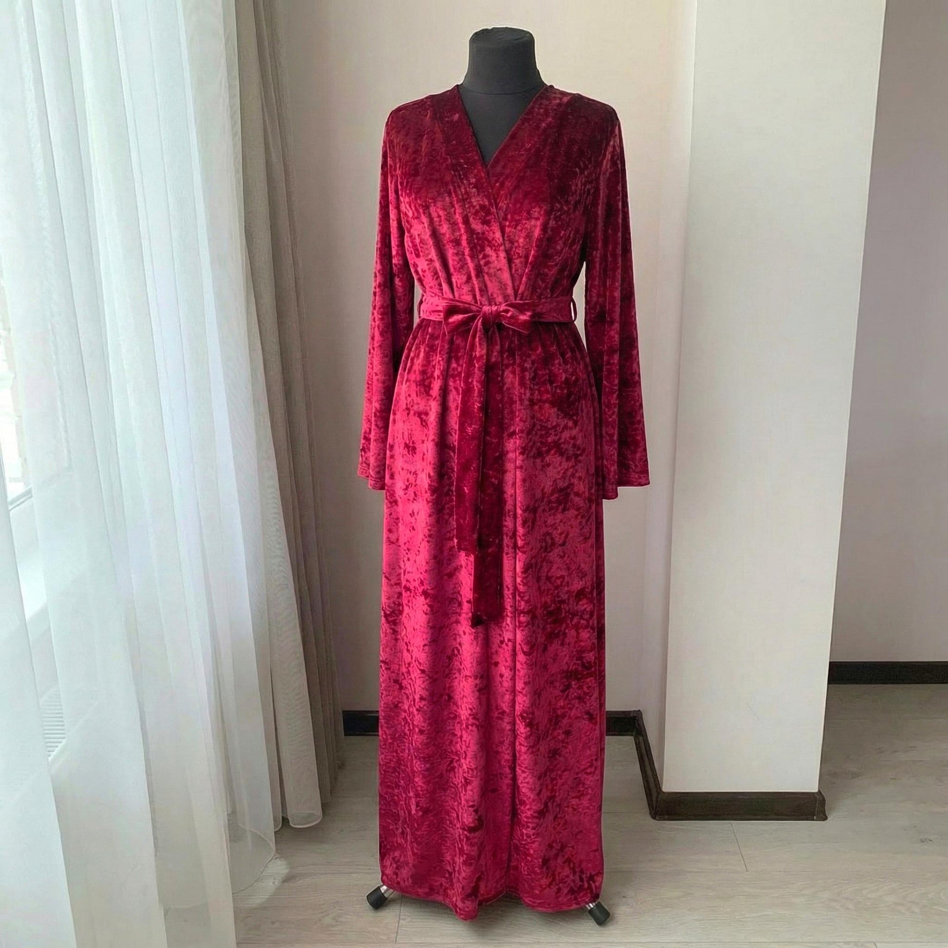 Crushed velvet burgundy robe worn floor-length, front view