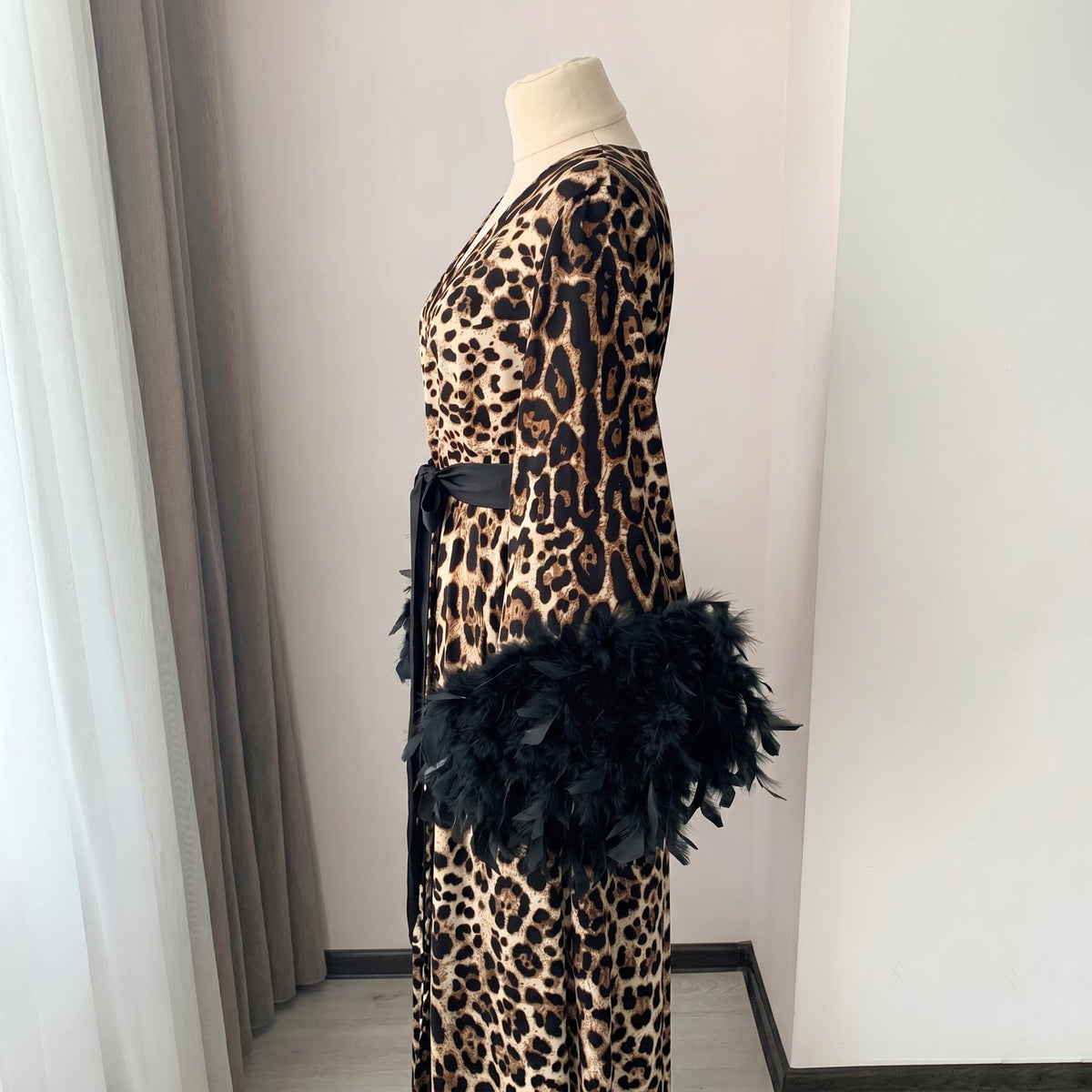 Animal print satin dressing gown with black feather details on the sleeve cuffs