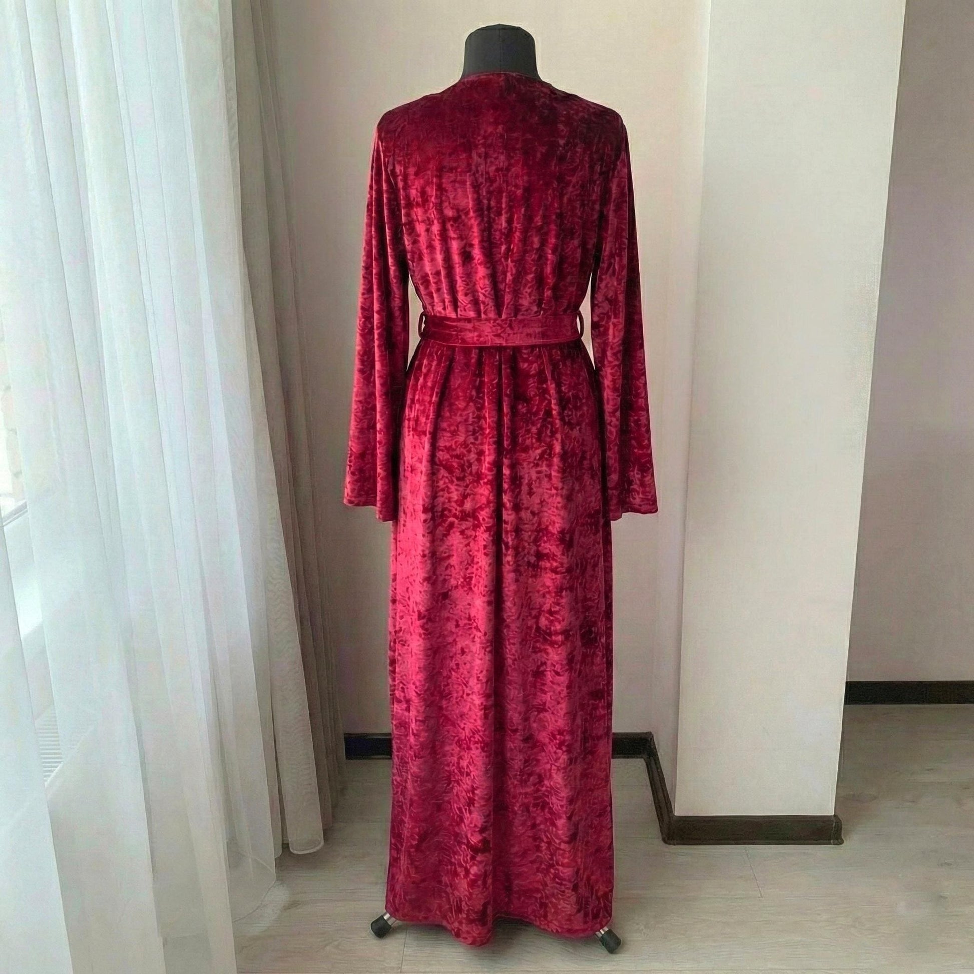 Crushed velvet burgundy robe worn by model, back view