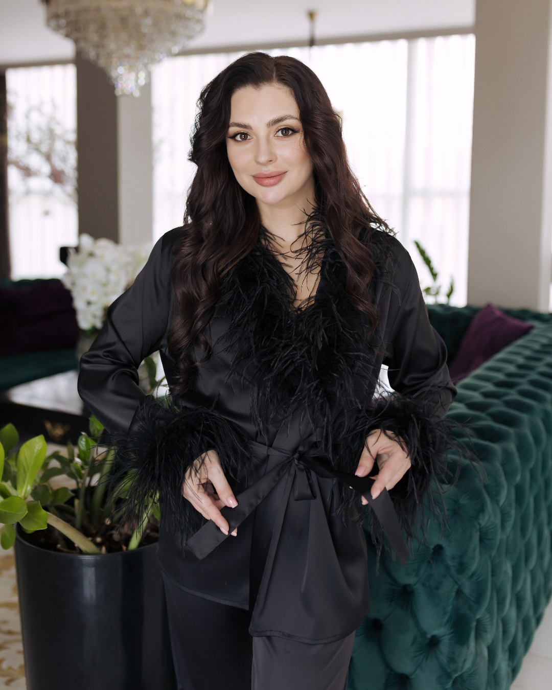 a woman in a black outfit posing for a picture