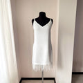 Short satin feather slip dress for a bridal getting-ready look