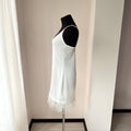 Satin bridal nightgown featuring an above-knee hem with ostrich feathers