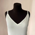 Ostrich feather trim detail on a handmade satin bridal slip dress