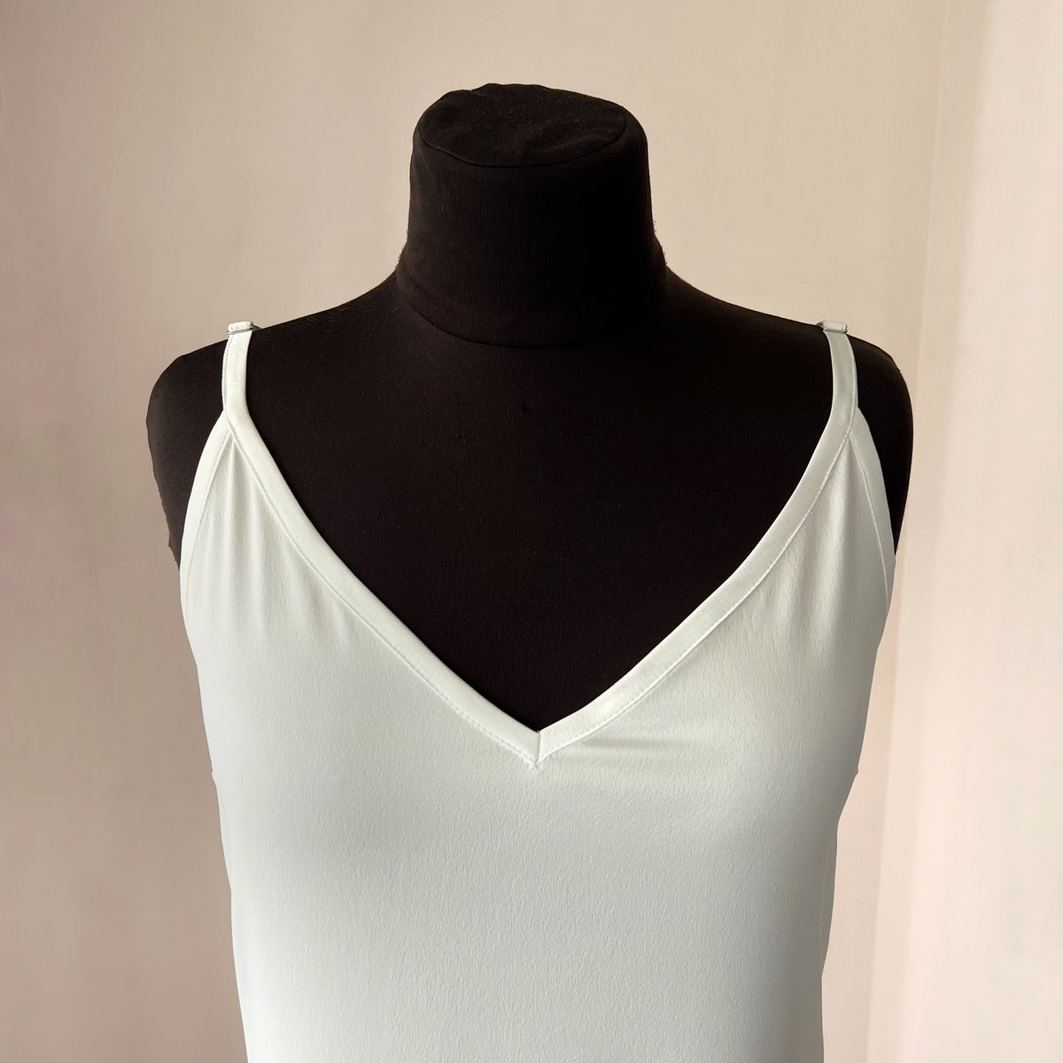 Ostrich feather trim detail on a handmade satin bridal slip dress