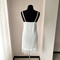 Bridal slip dress with soft satin fabric and feather-trimmed hem