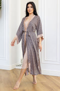 Elegant women's robe with geometric pattern and soft blush lining.