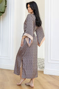 Rear view of geometric patterned robe with contrasting light pink accents.