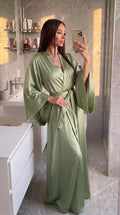 Olive green long satin kimono robe with tie belt worn by model