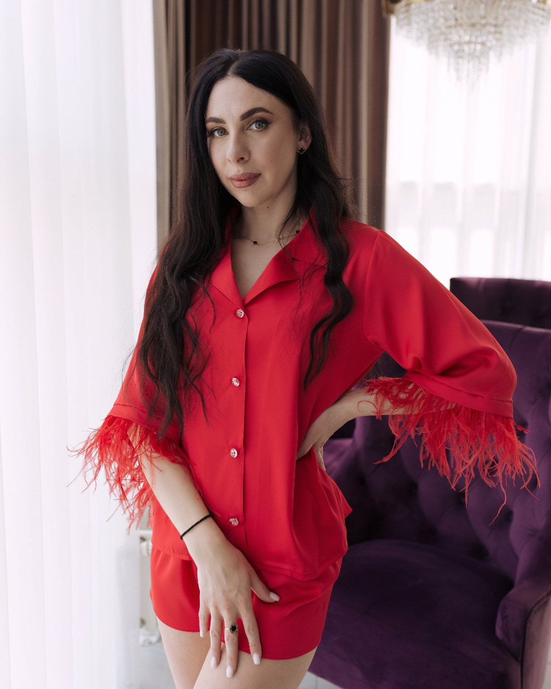 a woman in a red shirt posing for a picture