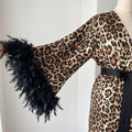 Leopard print feather robe with floor-length shape and soft satin appearance