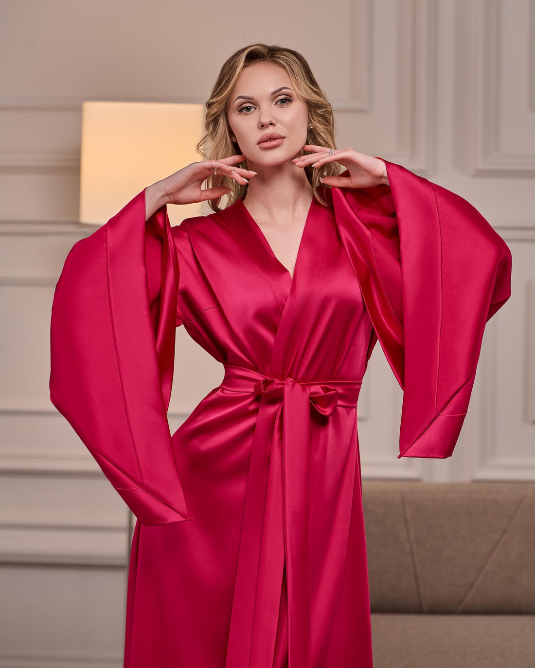 Fuchsia hot pink silk satin kimono robe with wide 3/4 sleeves and tie belt – close-up on model