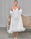 White satin wrap robe with soft feather details on the sleeves and hem