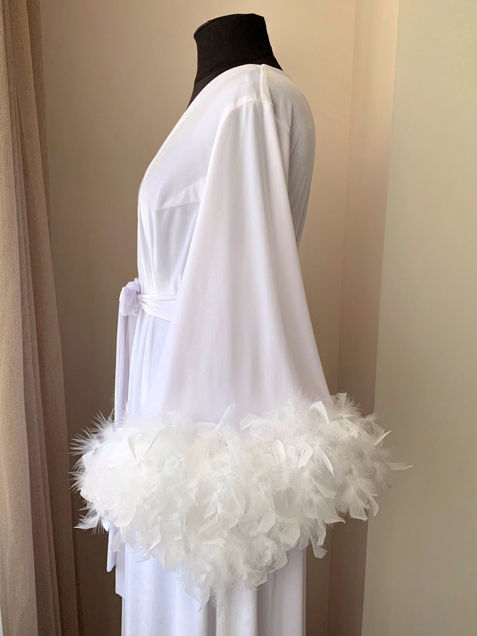 White velvet feather robe worn by model, back view