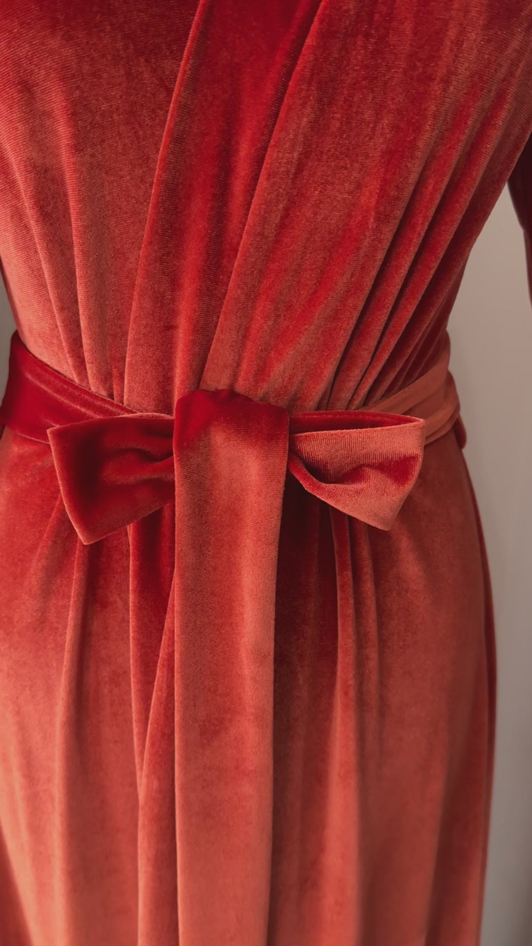 Video of burnt orange floor-length velvet wrap robe