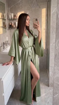Video of an olive green silk satin kimono robe in motion