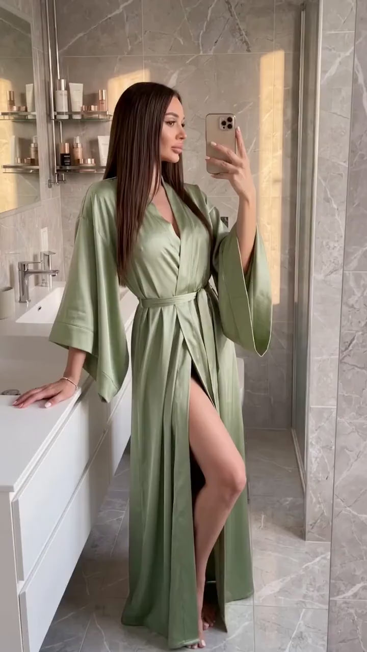 Video of an olive green silk satin kimono robe in motion