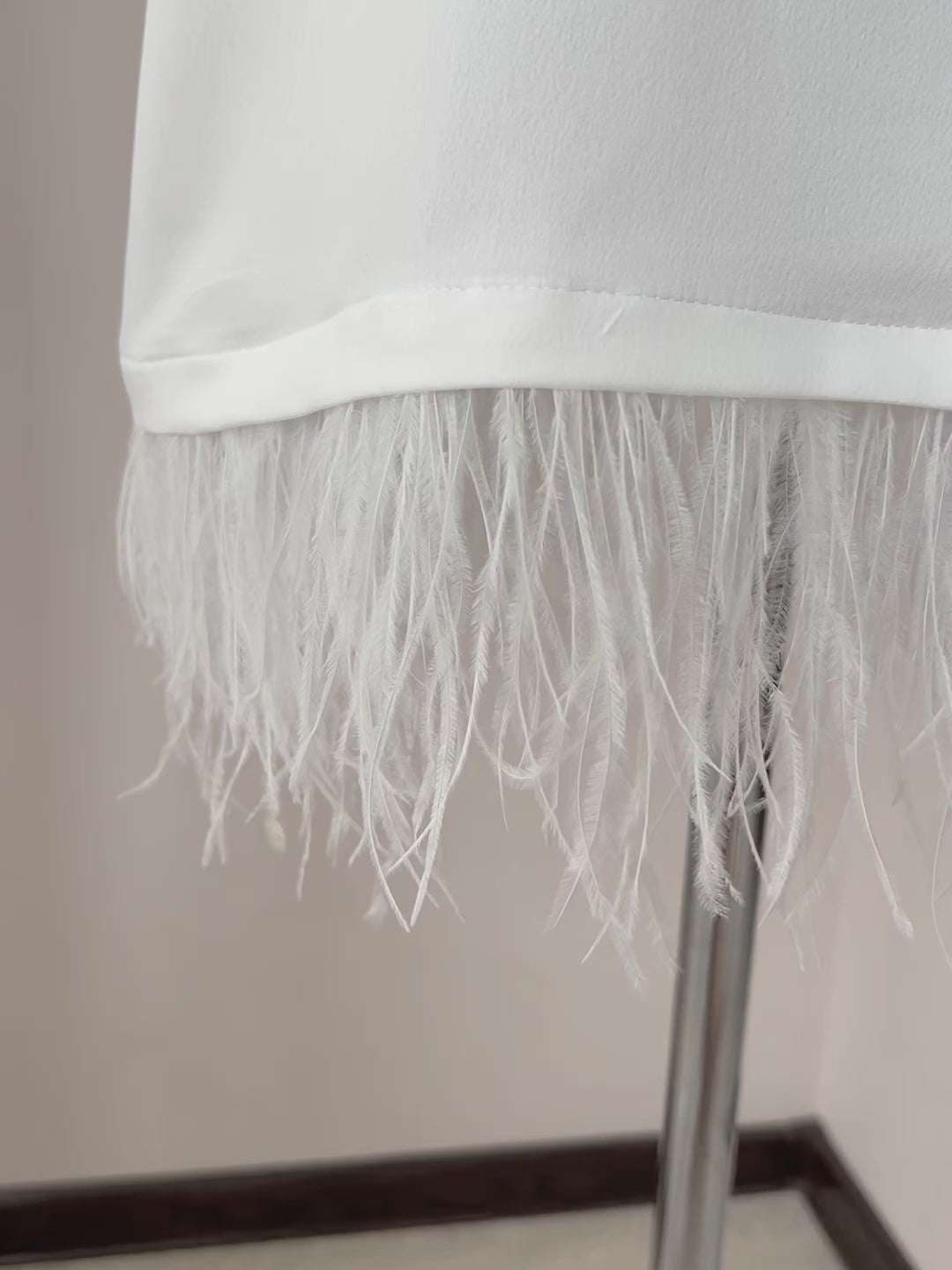 Video of satin bridal slip dress with ostrich feather trim