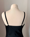 a mannequin with a black top on it