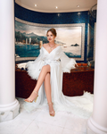 white bridal robe with feathers and train